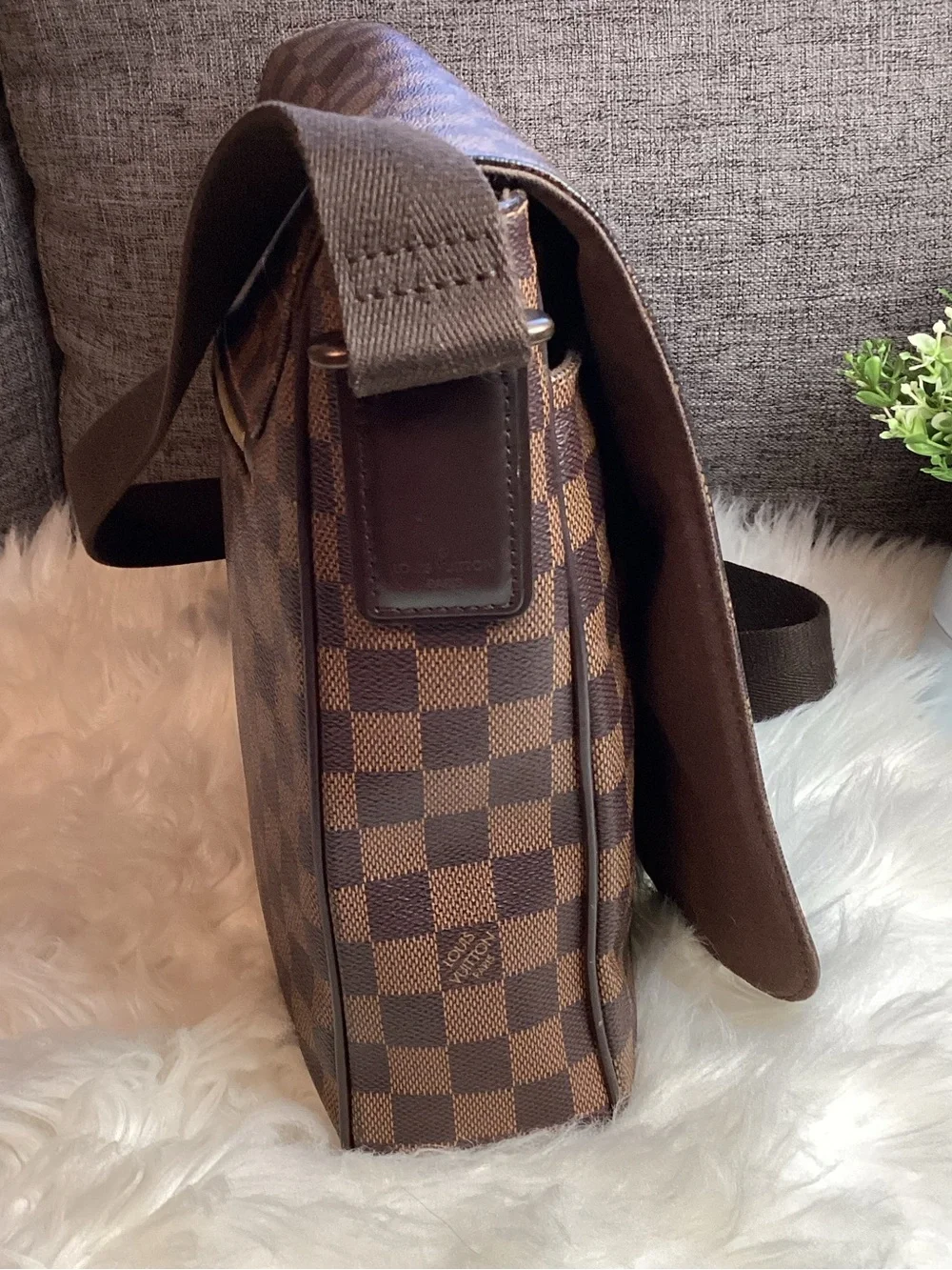 Louis Vuitton Damier Ebene District MM messenger bag.